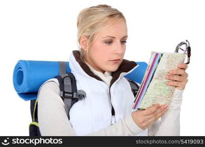 Backpacker with a map and compass