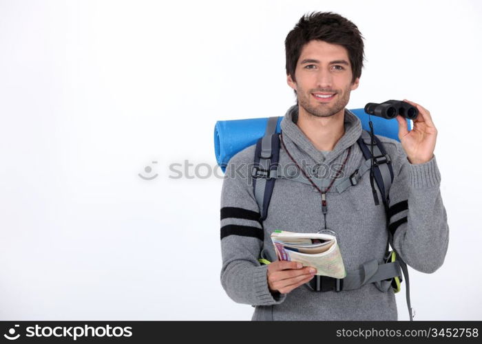 Backpacker with pair of binoculars
