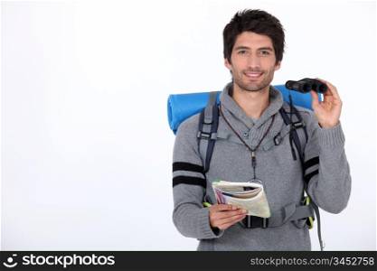 Backpacker with pair of binoculars