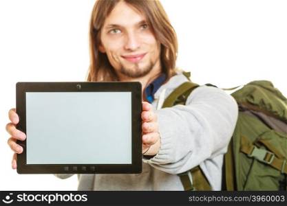 Backpacker with tablet. Blank screen copyspace.. Backpacker man holding tablet computer with blank screen showing copyspace. Tourist traveler advertising technology.