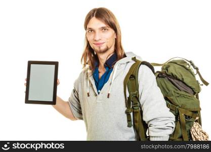 Backpacker with tablet. Blank screen copyspace.. Backpacker man holding tablet computer with blank screen showing copyspace. Tourist traveler advertising new modern technology.