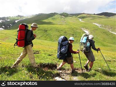Backpackers family in mountains