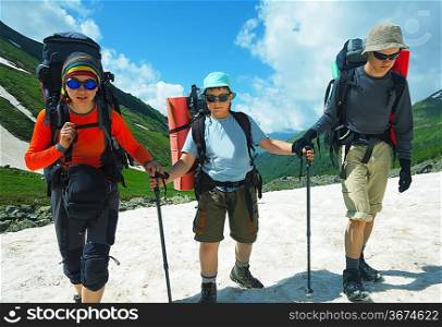 Backpackers on mountains lake