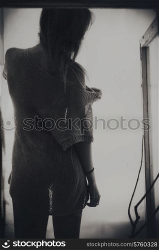 Backrest of beautiful young long-haired woman on a white background