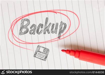 Backup note with a disk sketch and a red marker