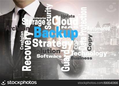 Backup wordcloud touchscreen is shown by businessman.. Backup wordcloud touchscreen is shown by businessman