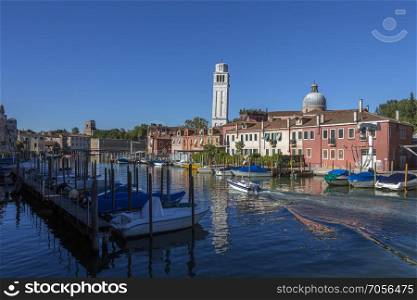 Backwater on the island of Burano in the Venetian Lagoon, northern Italy. It is situated near Torcello at the northern end of the Lagoon, and is known for its lace work and brightly colored homes.