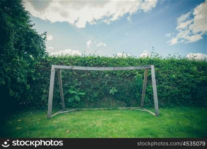 Backyard soccer goal on a green lawn in the summer