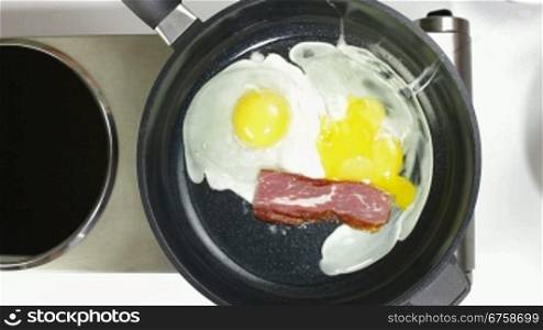 Bacon And Eggs Frying In The Pan