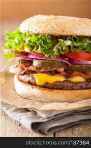 bacon cheese burger with pickles tomato onion