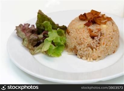 Bacon fried rice with chili on dish.