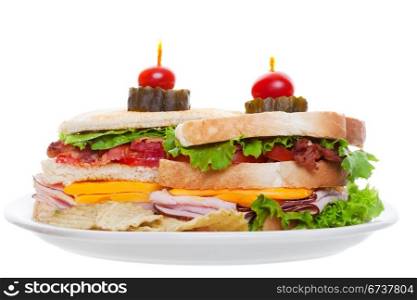 Bacon ham and cheese club sandwich with chips isolated on white background