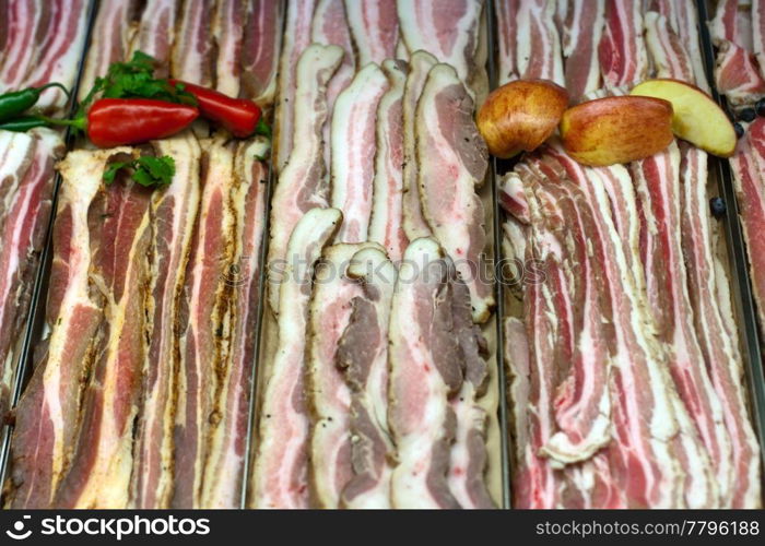 Bacon, pork belly in grocery store display