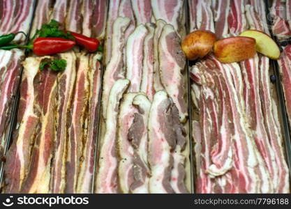 Bacon, pork belly in grocery store display