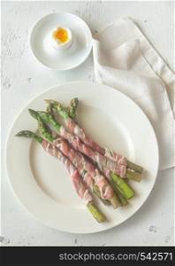 Bacon wrapped asparagus dippers with soft-boiled egg on the table