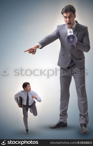 Bad angry boss shouting at employee with loudspeaker