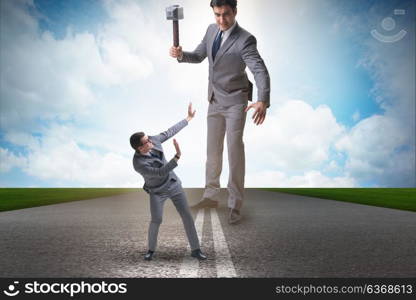 Bad angry boss threatening employee with hammer