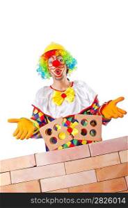 Bad construction concept with clown laying bricks