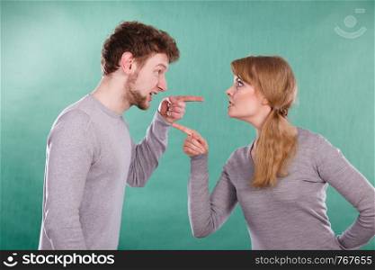 Bad relationship and divorce. Expressive young couple yelling shouting. Husband and wife having big emotional argue split quarrel.. Husband and wife yelling and arguing.