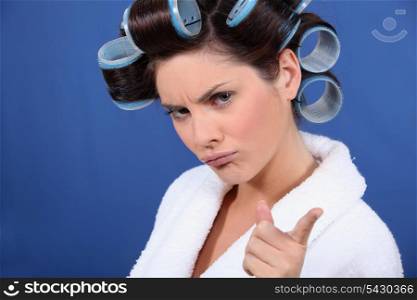 bad tempered woman with curlers in her hair
