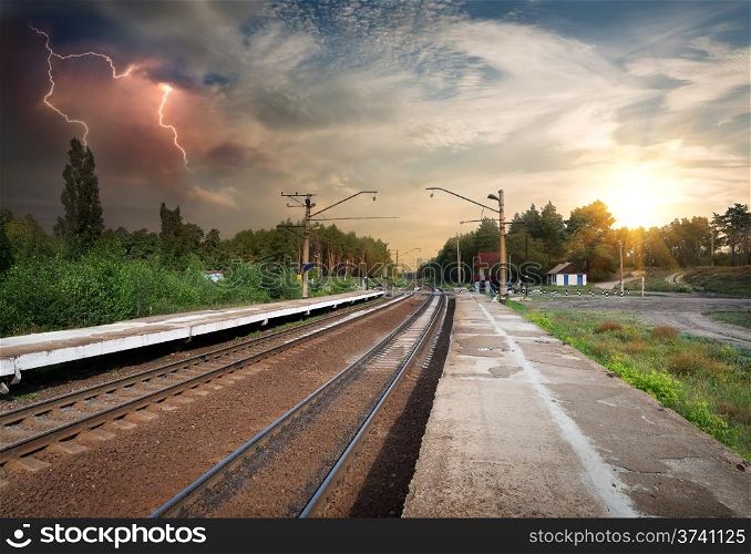 Bad weather and storm clouds over railroad