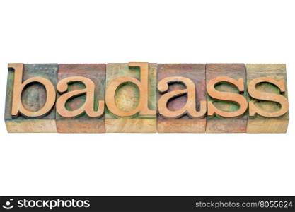 badass - isolated word abstract in letterpress wood type printing blocks stained by color inks
