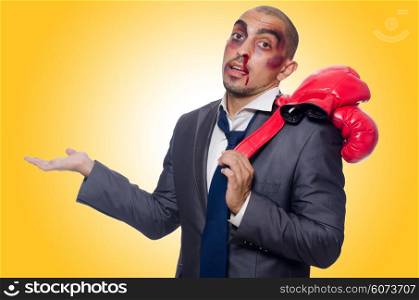 Badly beaten businessman with boxing gloves
