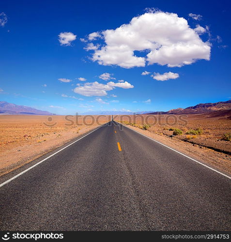 Badwater road Death Valley straight in desert to mountains National Park California