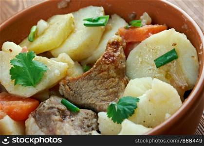 Baeckeoffe - ypical dish from French , Germany.mix of sliced potatoes, sliced onions, cubed mutton, beef and pork