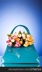 Bag and flowers against the colorful background