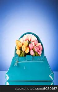 Bag and flowers against the colorful background
