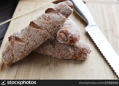 bagels of rye bread on wooden background