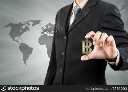 Baht symbol in businessman hand