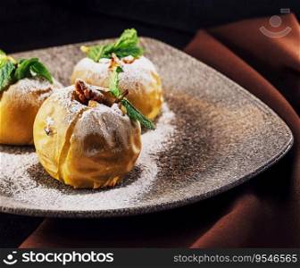 Baked apples stuffed with walnuts on plate