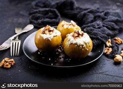 baked apples with nuts and honey, desert on plate