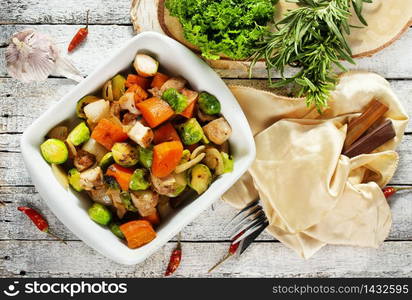 baked begetasbles, diet food, vegetables in white bowl