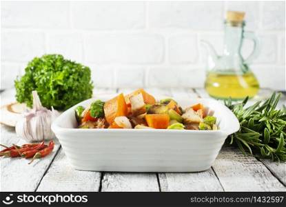 baked begetasbles, diet food, vegetables in white bowl