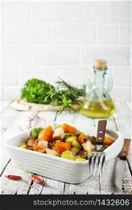 baked begetasbles, diet food, vegetables in white bowl