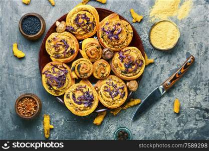 Baked buns with potatoes and mushrooms.Turmeric dough.. Turmeric buns with vegetable filling