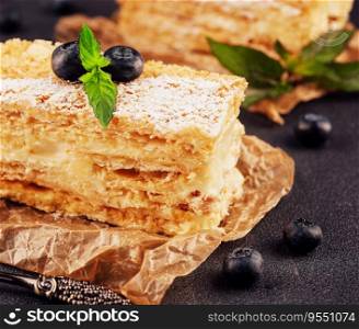 baked cake Napo≤on, Mil≤feuil≤garnished with blueberry and m∫
