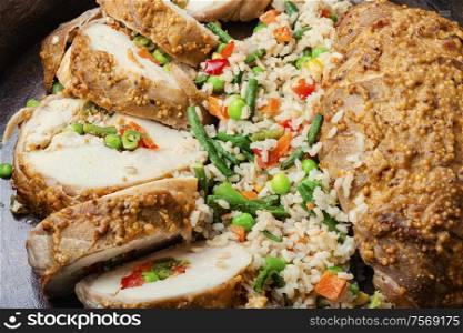 Baked chicken breast with vegetables and a side dish of risotto.Roasted chicken meat.Healthy food,grilled chicken. Baked meat and risotto