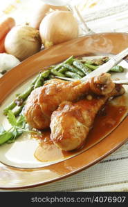 Baked chicken in tomato sauce with green beans on the side