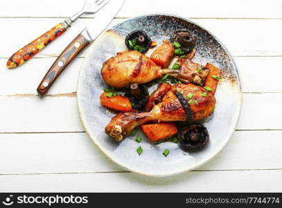 Baked chicken legs with pumpkin and mushrooms. Autumn meat recipe. Baked chicken drumsticks with pumpkin