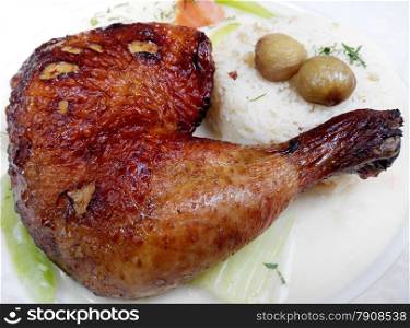 Baked chicken legs with rice and vegetables