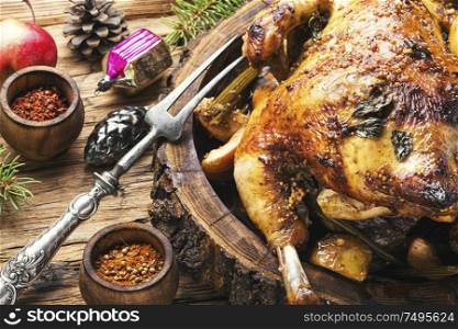 Baked chicken stuffed with apples for Christmas.Christmas dinner. Baked turkey or chicken