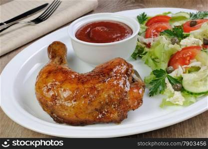 Baked chicken thigh with sauce and salad
