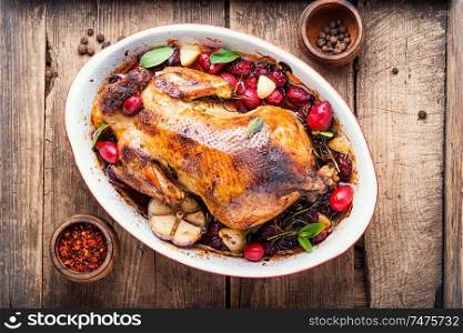 Baked chicken with dogwood.Roast chicken in berry sauce. Baked chicken in berry sauce
