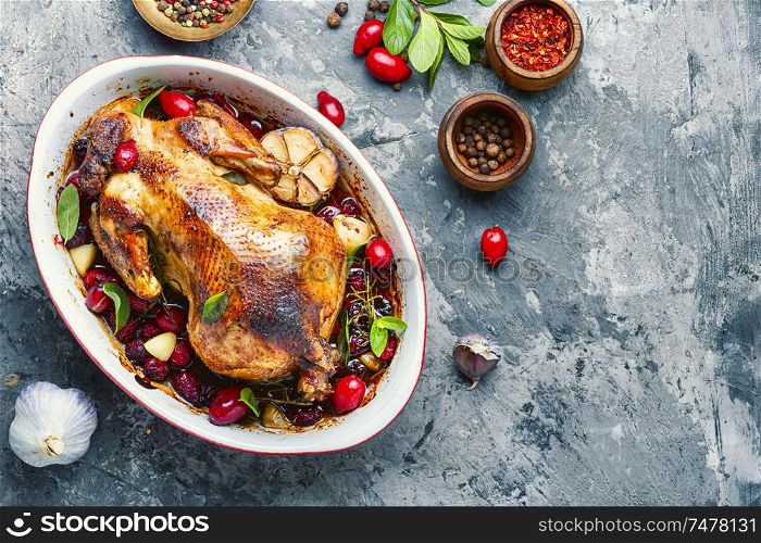 Baked chicken with dogwood.Roast chicken in berry sauce. Baked whole chicken