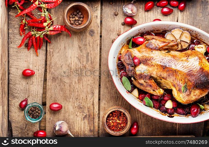 Baked chicken with dogwood.Roast chicken in berry sauce.Space for text. Baked chicken in berry sauce