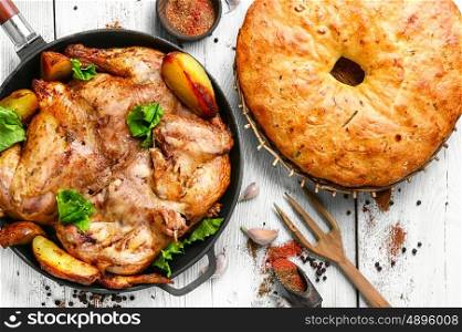 Baked chicken with potatoes. Grilled chicken cooked in pan with spices according to the Georgian recipe
